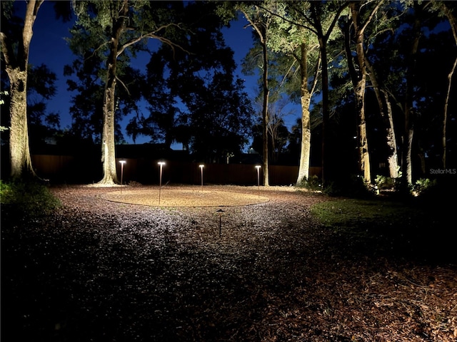 view of yard at twilight