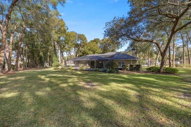 view of yard with a lanai