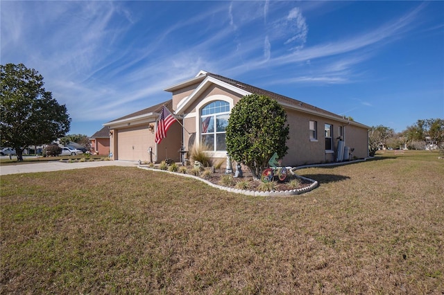 view of front of home with a front yard and a garage