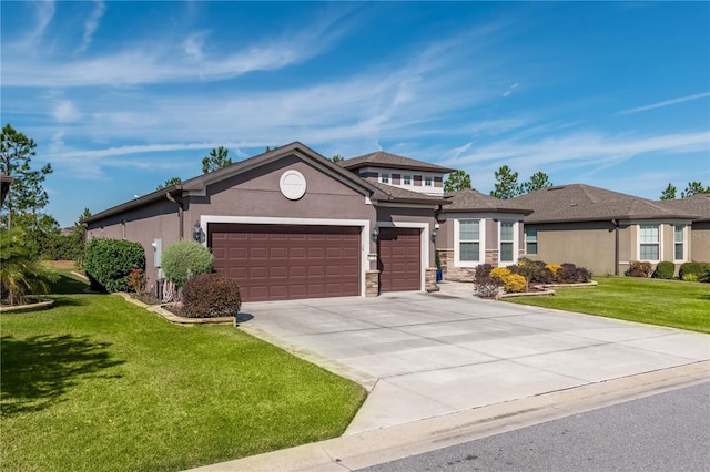 view of front facade featuring a front yard and a garage