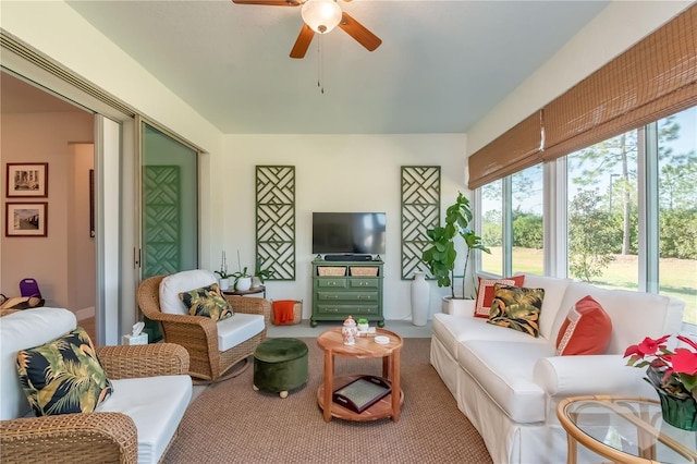 sunroom / solarium featuring ceiling fan