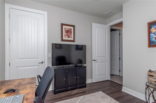 office with dark hardwood / wood-style floors