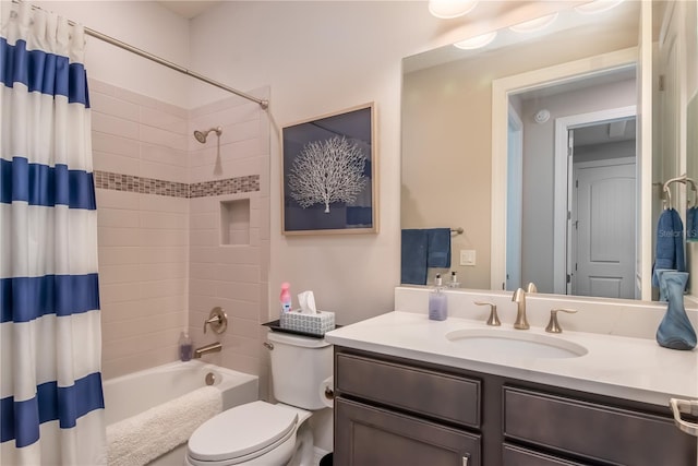 full bathroom with shower / bath combination with curtain, toilet, and vanity