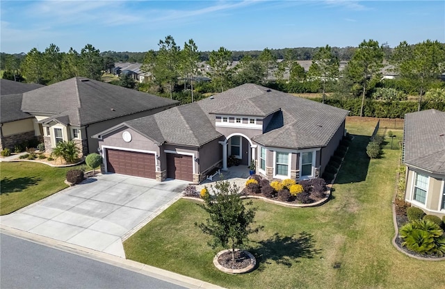 view of front facade featuring a garage and a front lawn