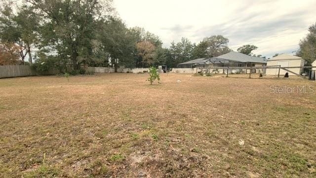 view of yard featuring fence