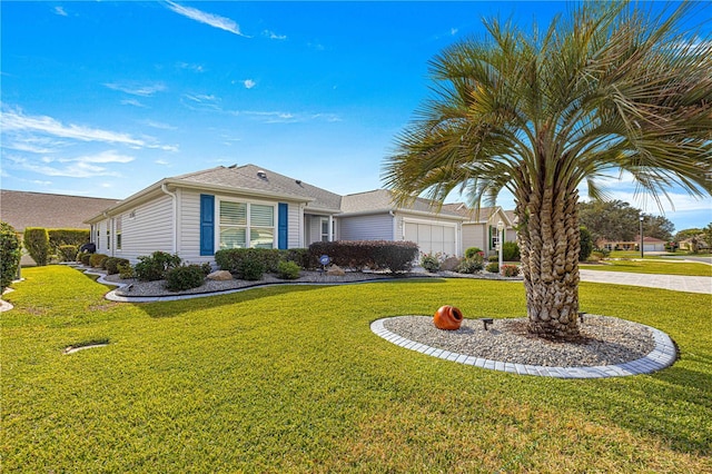 ranch-style home featuring a front yard and a garage