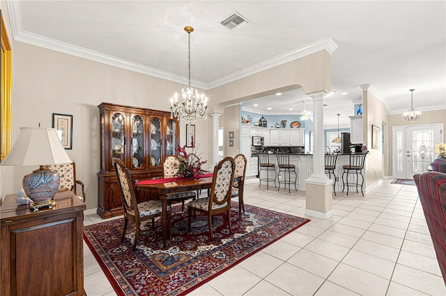 dining room with light tile patterned floors, a chandelier, and ornamental molding