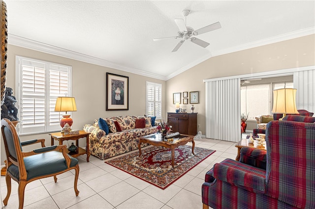 living room with ceiling fan, a textured ceiling, vaulted ceiling, light tile patterned floors, and ornamental molding