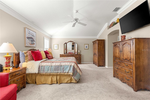 bedroom featuring ceiling fan, light colored carpet, ornamental molding, and a textured ceiling