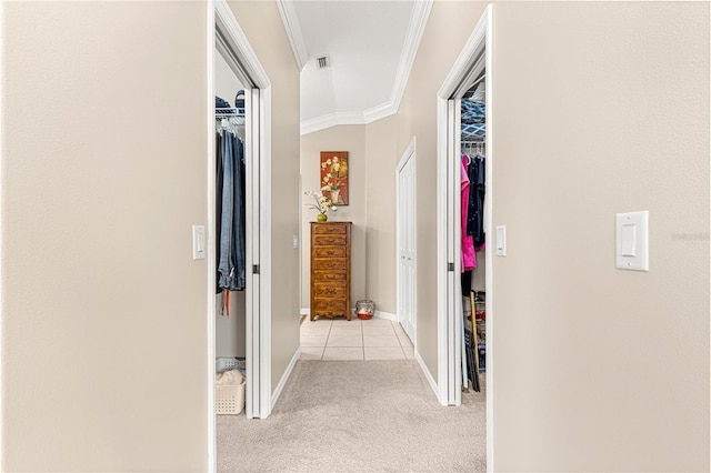 corridor featuring lofted ceiling, light colored carpet, and ornamental molding