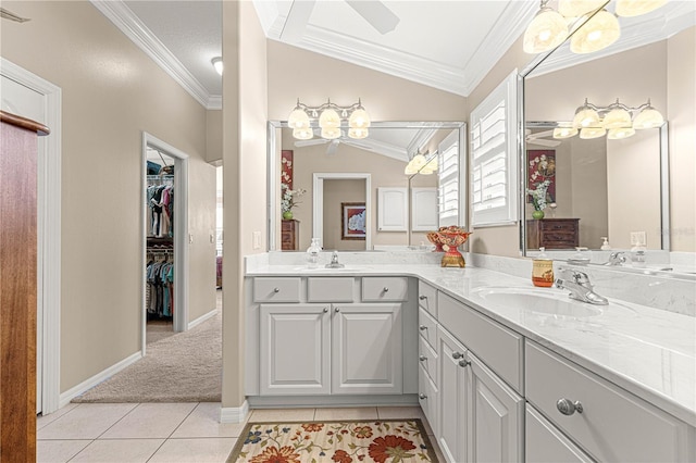 bathroom featuring tile patterned floors, vanity, vaulted ceiling, and ornamental molding