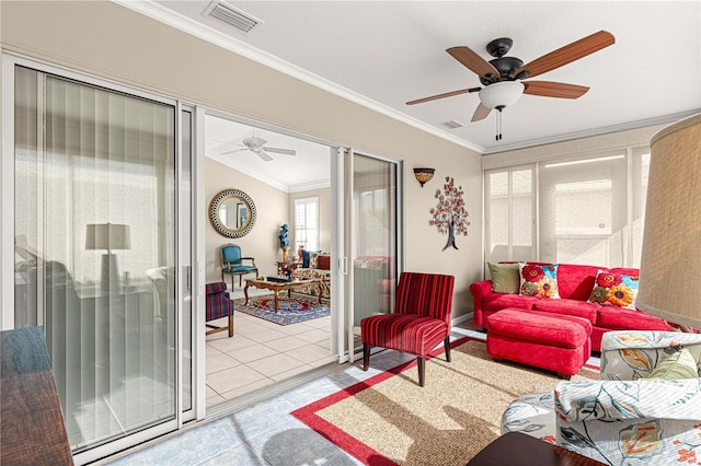 living room featuring ceiling fan, light tile patterned floors, and ornamental molding