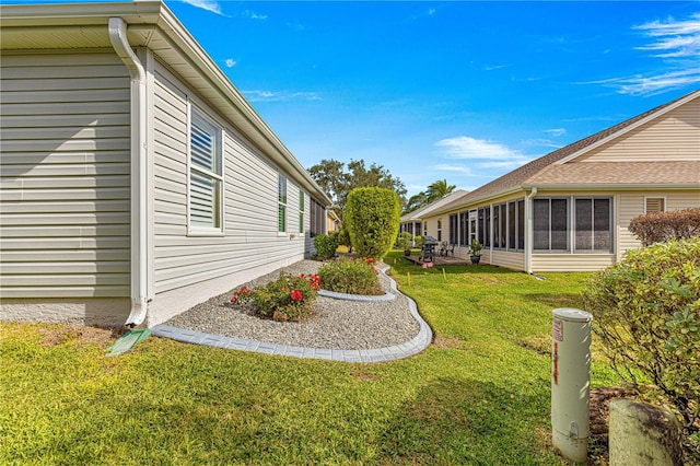 view of yard with a sunroom