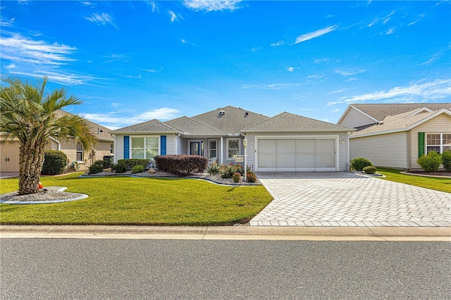 single story home featuring a front yard and a garage