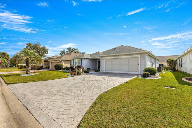 single story home featuring a garage, central air condition unit, and a front lawn