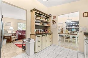 kitchen with ceiling fan and light tile patterned flooring