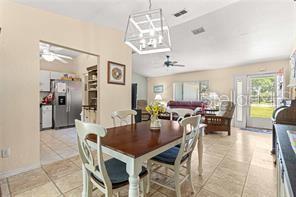 dining room featuring ceiling fan and light tile patterned flooring