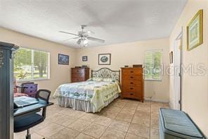 bedroom featuring ceiling fan and light tile patterned flooring