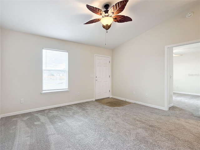 unfurnished room with carpet flooring, ceiling fan, and lofted ceiling