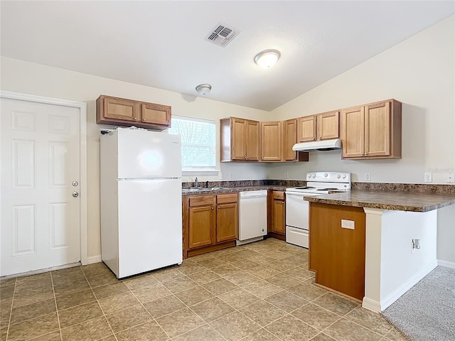 kitchen featuring white appliances, sink, and vaulted ceiling