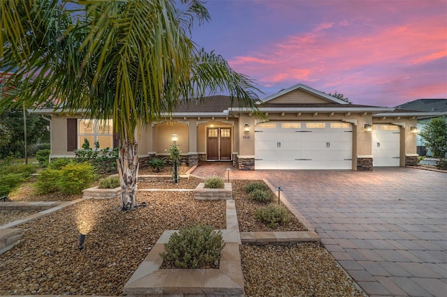 view of front of home with a garage