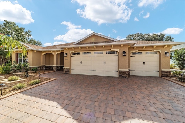 view of front of property with a garage