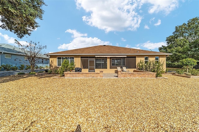 back of house featuring a patio