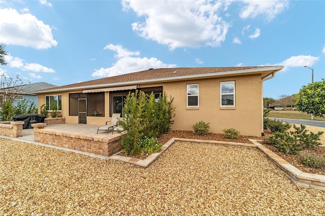 rear view of house with a patio area