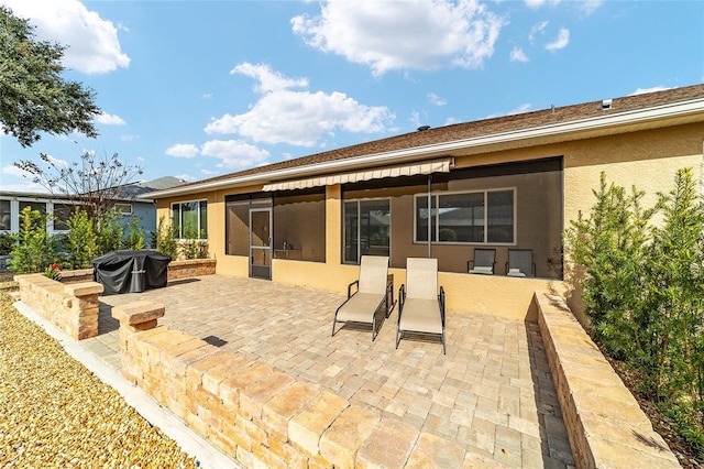 rear view of property with a patio area