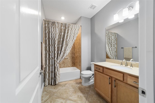 full bathroom featuring shower / bath combo, vanity, and toilet