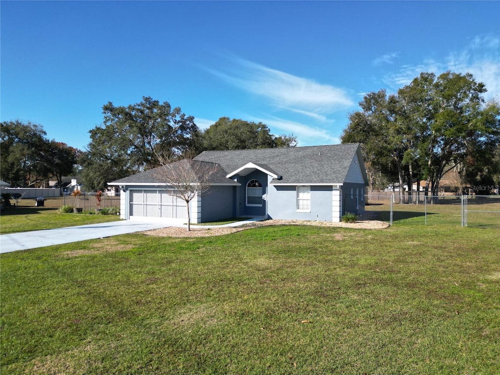 ranch-style house with a front yard and a garage