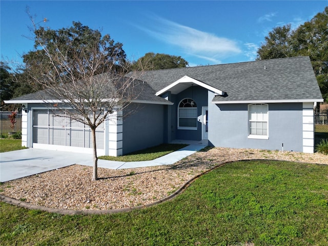 ranch-style home with a front lawn and a garage