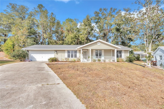 ranch-style house with a front yard, covered porch, and a garage