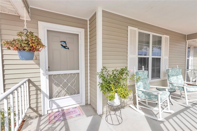 doorway to property featuring covered porch