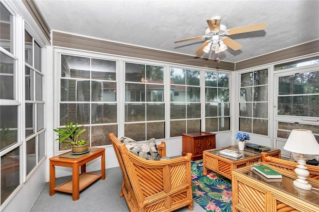 sunroom with ceiling fan