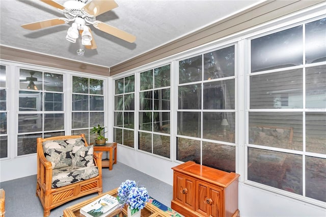 sunroom with ceiling fan