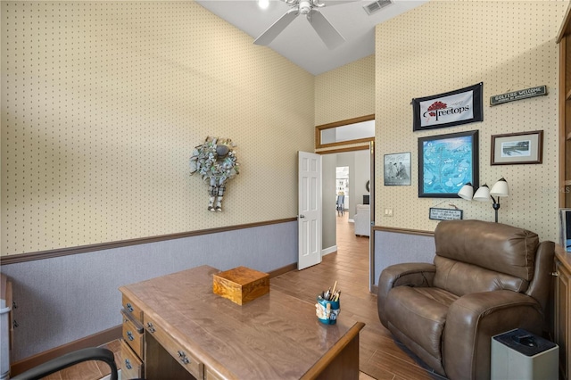 interior space featuring ceiling fan and dark wood-type flooring