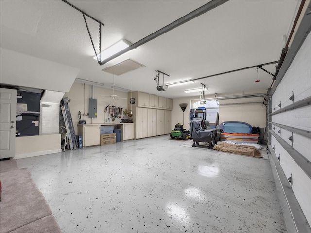 garage featuring a garage door opener and electric panel