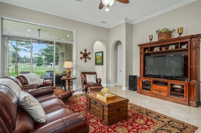 living room with ceiling fan, crown molding, and light tile patterned floors