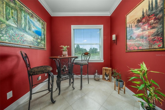 tiled dining room featuring ornamental molding