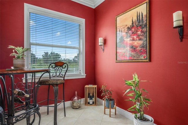 interior space featuring light tile patterned floors and ornamental molding