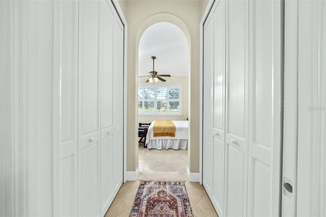 hallway with light tile patterned floors