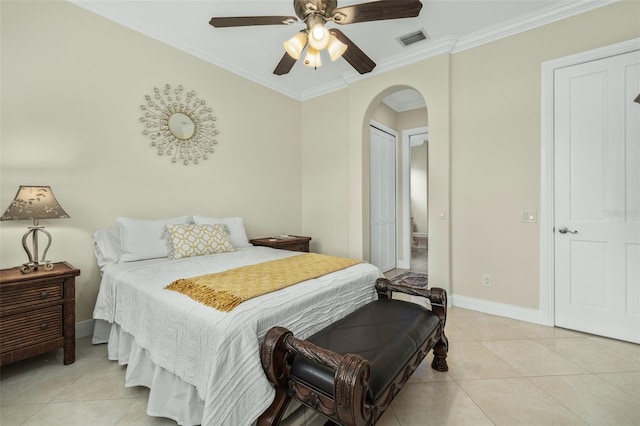 bedroom featuring ceiling fan, crown molding, and light tile patterned flooring