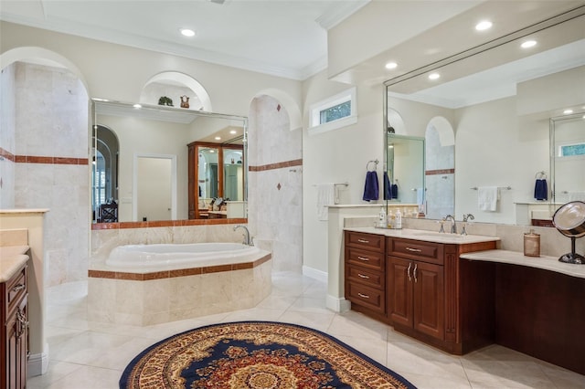 bathroom featuring vanity, tiled bath, tile patterned floors, and crown molding