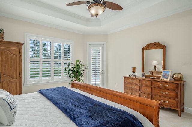 tiled bedroom featuring multiple windows, a raised ceiling, ceiling fan, and crown molding