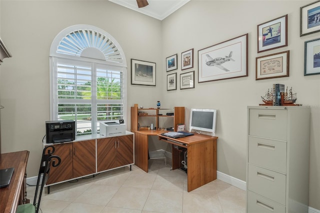 office area with light tile patterned floors, plenty of natural light, and ornamental molding