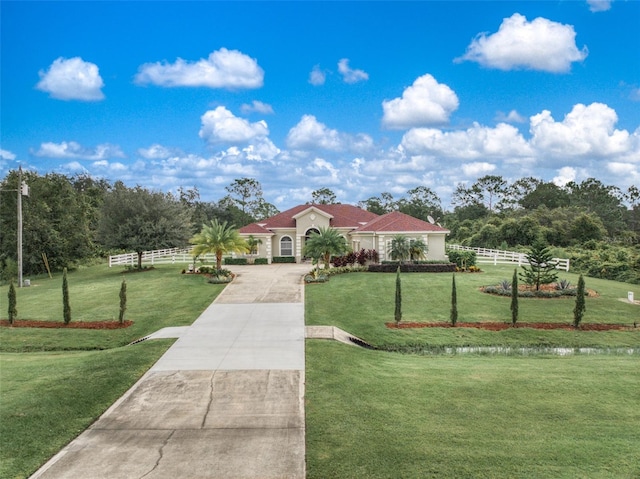 exterior space featuring a rural view and a front lawn