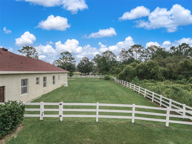 view of yard with a rural view