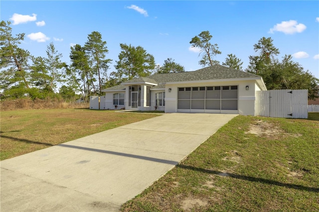 ranch-style home featuring a front lawn and a garage