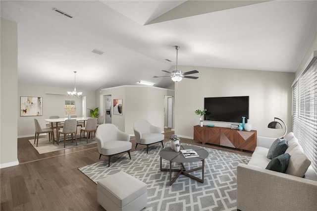 living room featuring ceiling fan with notable chandelier, wood-type flooring, and lofted ceiling